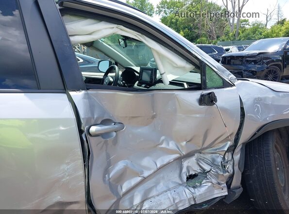 JTMF1RFV6MD075542 2021 TOYOTA RAV4 Silver Front interior view