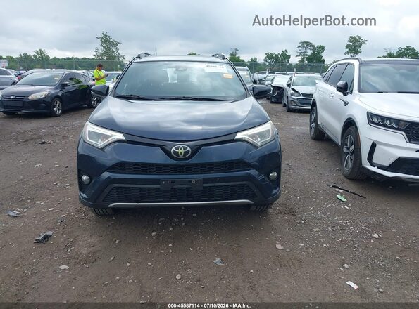 JTMJFREV7HJ708571 2017 TOYOTA RAV4 Dark Blue Vista interior trasera