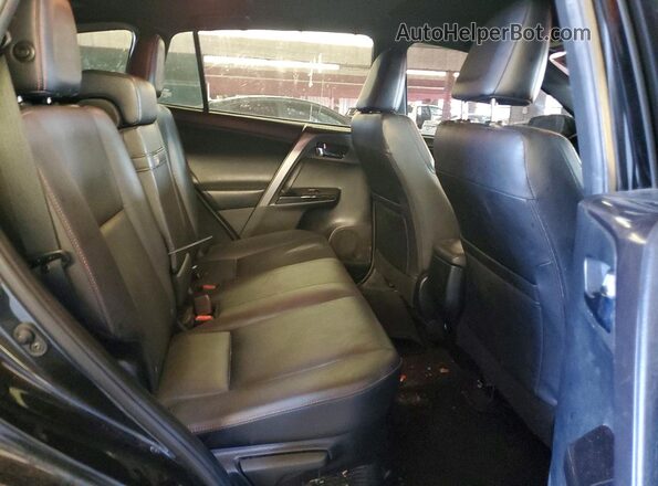 JTMJJREV0JD155118 2018 TOYOTA RAV4 Black Vista interior trasera