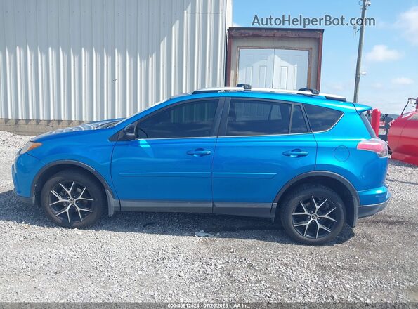 JTMNFREV1GD081140 2016 TOYOTA RAV4 Light Blue Rear interior view