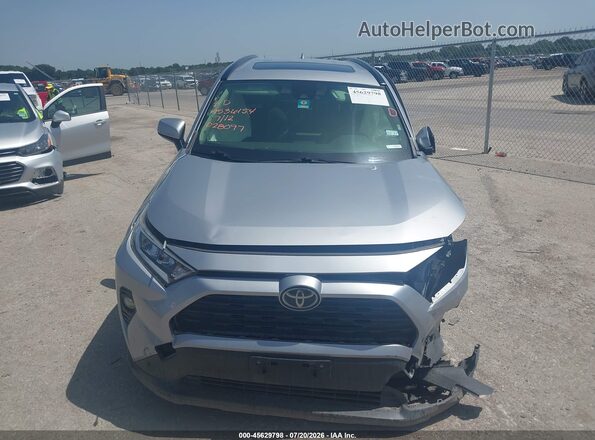 JTMP1RFV5KD028097 2019 TOYOTA RAV4 Silver Սարքավորումների վահանակի տեսք