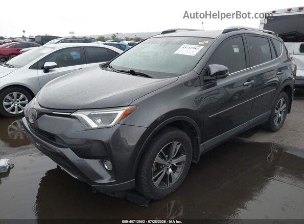 JTMRFREV3HJ155744 2017 TOYOTA RAV4 Gray Vista tres cuartos delantera izquierda