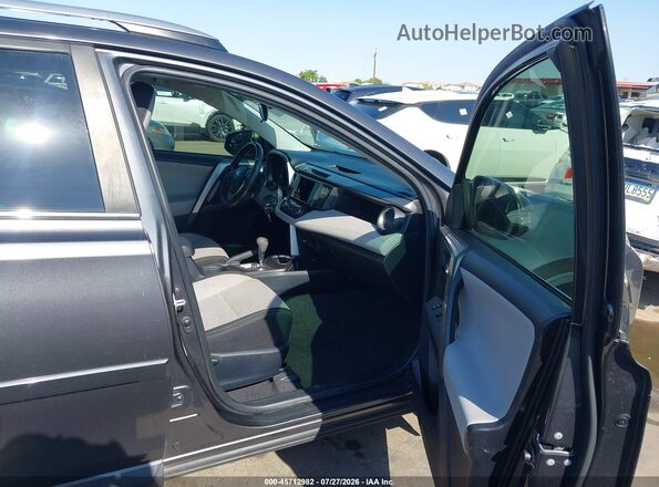 JTMRFREV3HJ155744 2017 TOYOTA RAV4 Gray Vista interior delantera