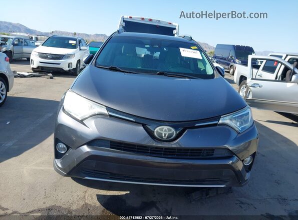 JTMRFREV3HJ155744 2017 TOYOTA RAV4 Gray Vista interior trasera