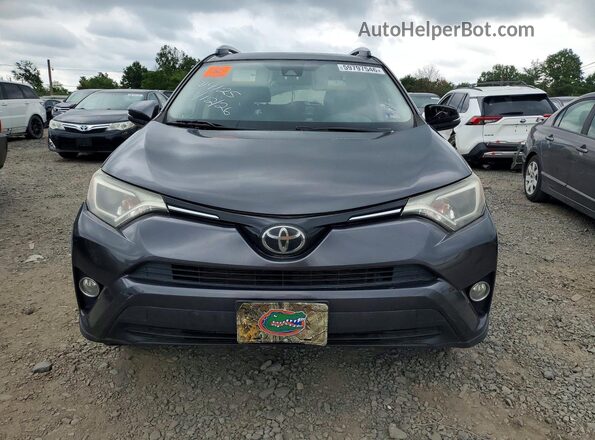 JTMRFREV4JJ246219 2018 TOYOTA RAV4 Gray Front view