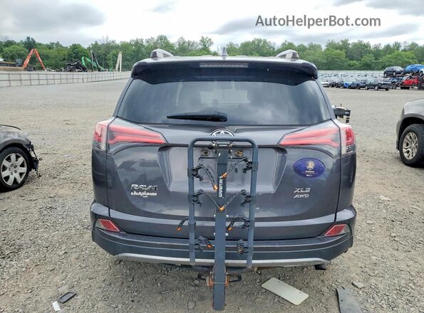 JTMRFREV4JJ246219 2018 TOYOTA RAV4 Gray Rear view