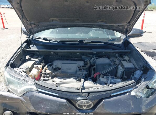 JTMRFREV8JJ728031 2018 TOYOTA RAV4 Gray Rear view