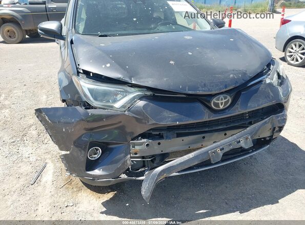 JTMRFREV8JJ728031 2018 TOYOTA RAV4 Gray Front view
