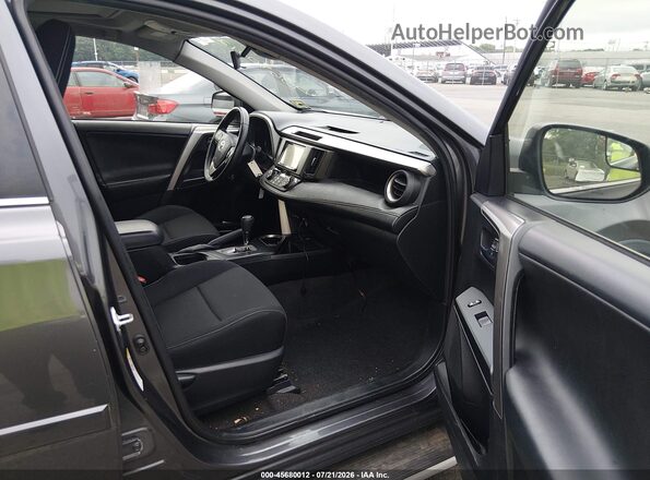 JTMRFREVXHJ702380 2017 TOYOTA RAV4 Gray Vista interior delantera