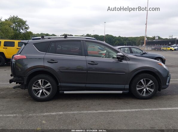 JTMRFREVXHJ702380 2017 TOYOTA RAV4 Gray Vista interior trasera
