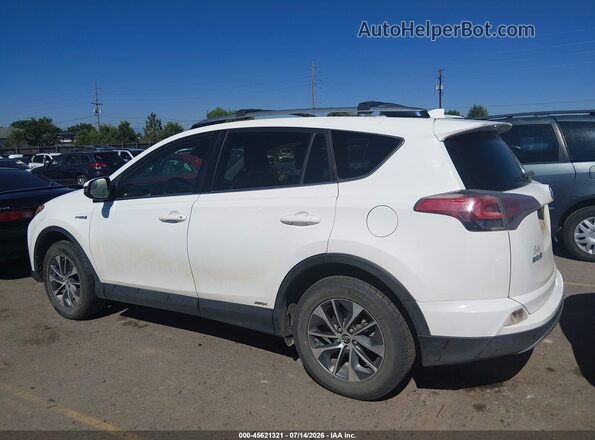 JTMRJREV2JD242277 2018 TOYOTA RAV4 HYBRID White Widok wnętrza z tyłu