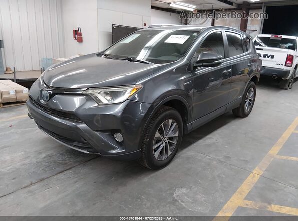 JTMRJREV9JD237030 2018 TOYOTA RAV4 HYBRID Gray Vista tres cuartos delantera izquierda