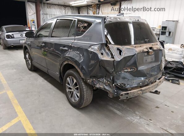 JTMRJREV9JD237030 2018 TOYOTA RAV4 HYBRID Gray Trasero izquierdo