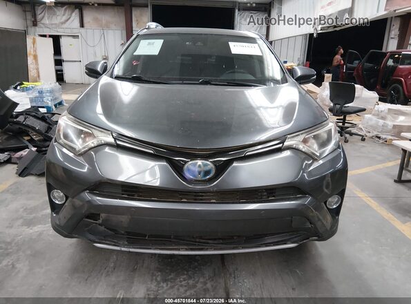 JTMRJREV9JD237030 2018 TOYOTA RAV4 HYBRID Gray Vista interior trasera