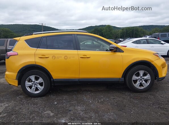 JTMRJREVXJD258775 2018 TOYOTA RAV4 HYBRID Yellow Vista interior trasera
