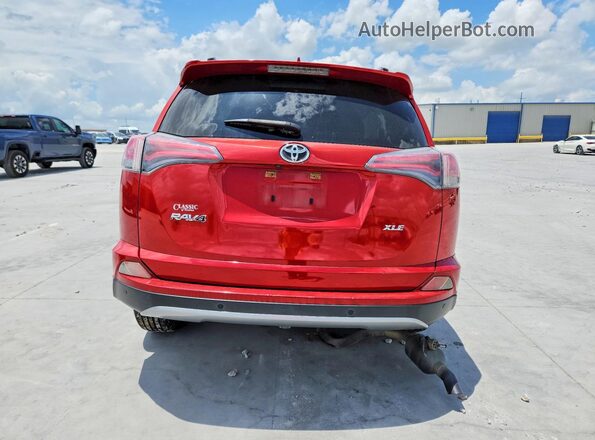 JTMWFREV0HJ117617 2017 TOYOTA RAV4 Red Rear view