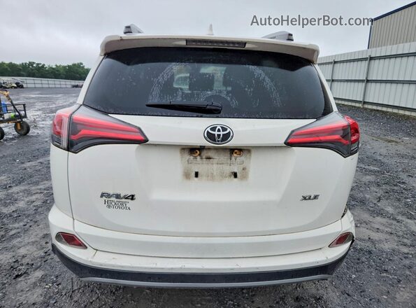 JTMWFREV0JJ747420 2018 TOYOTA RAV4 White Rear view