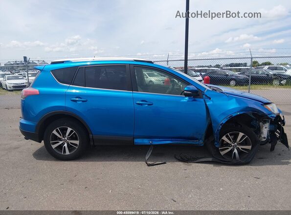 JTMWFREV1GJ083962 2016 TOYOTA RAV4 Blue Սալոնի հետևի տեսք
