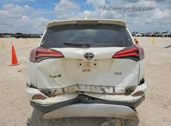 JTMWFREV1HJ718180 2017 TOYOTA RAV4 White Rear view