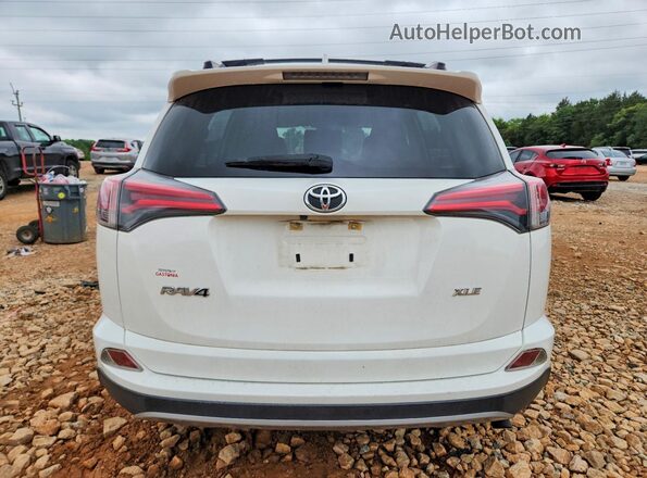 JTMWFREV2JJ170437 2018 TOYOTA RAV4 White Rear view