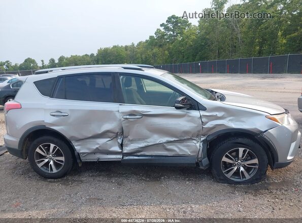 JTMWFREV2JJ195886 2018 TOYOTA RAV4 Silver Вид задньої частини салону