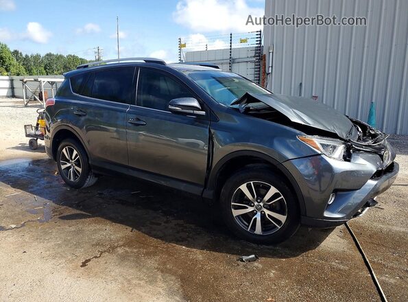JTMWFREV6HD099669 2017 TOYOTA RAV4 Gray Przód prawy