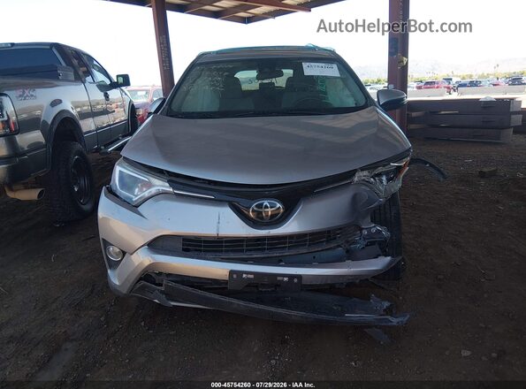 JTMWFREV6JJ173891 2018 TOYOTA RAV4 Silver ხელსაწყოთა პანელის ხედი