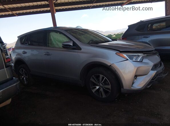 JTMWFREV6JJ173891 2018 TOYOTA RAV4 Silver უკანა სალონის ხედი