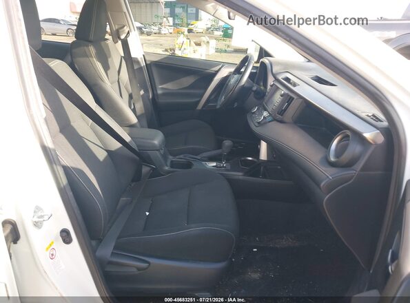 JTMWFREV6JJ192179 2018 TOYOTA RAV4 White Front interior view
