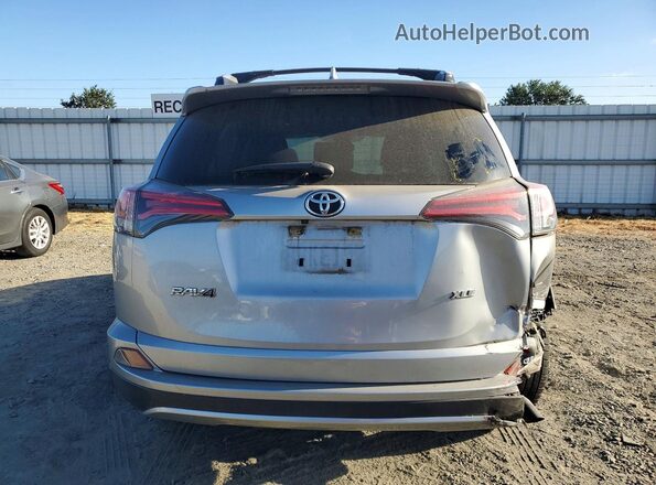 JTMWFREV6JJ200300 2018 TOYOTA RAV4 Silver Вид ззаду