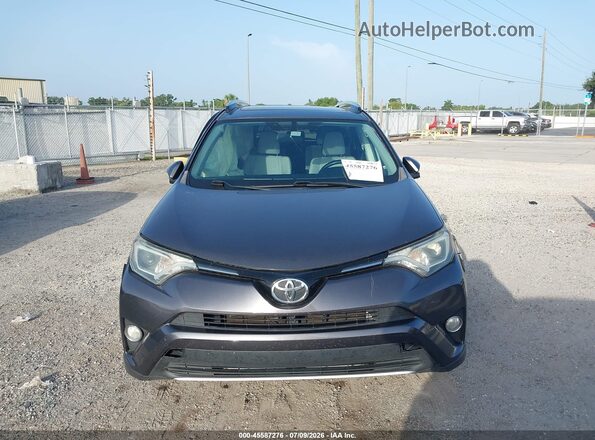 JTMWFREV7GJ094903 2016 TOYOTA RAV4 Gray ხელსაწყოთა პანელის ხედი