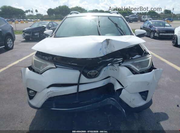 JTMWFREV7JJ200757 2018 TOYOTA RAV4 White Dashboard view