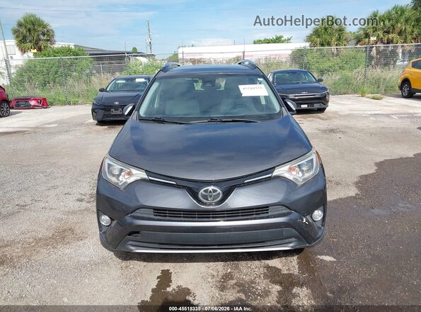 JTMWFREV8HJ101309 2017 TOYOTA RAV4 Gray ხელსაწყოთა პანელის ხედი