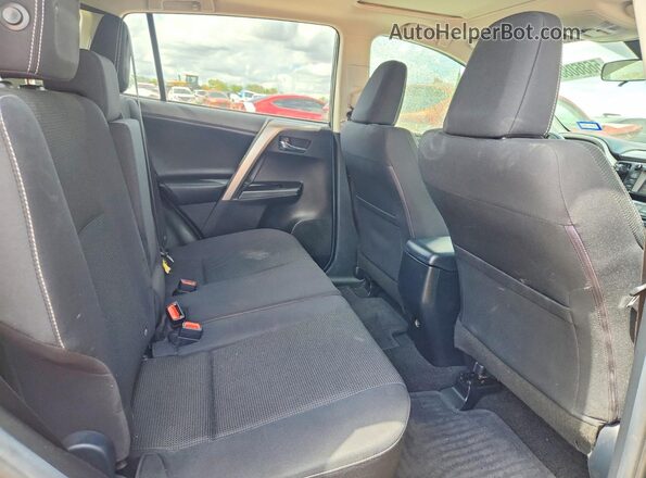 JTMWFREV8JJ728372 2018 TOYOTA RAV4 Gray Vista interior trasera