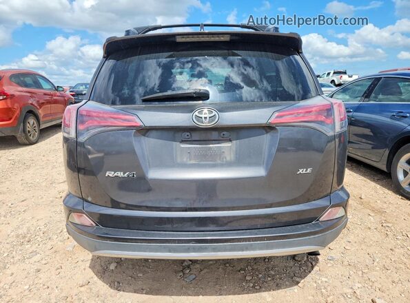 JTMWFREV8JJ728372 2018 TOYOTA RAV4 Gray Vista trasera