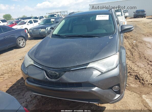 JTMWFREV9GJ084132 2016 TOYOTA RAV4 Gray Սարքավորումների վահանակի տեսք