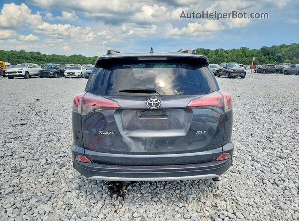 JTMWFREV9HD094689 2017 TOYOTA RAV4 Gray Rear view