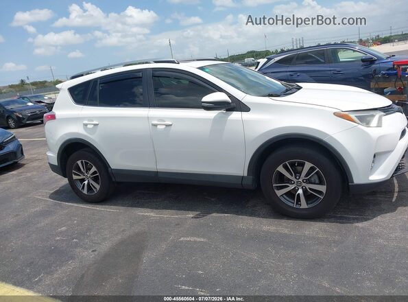 JTMWFREV9HJ102338 2017 TOYOTA RAV4 White Vista interior trasera