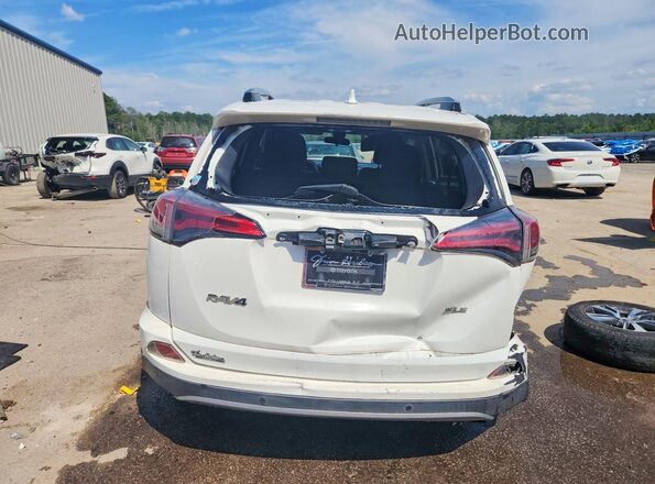 JTMWFREVXHJ718551 2017 TOYOTA RAV4 White Rear view
