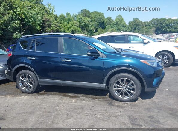 JTMYFREV0HJ148018 2017 TOYOTA RAV4 Blue Rear interior view