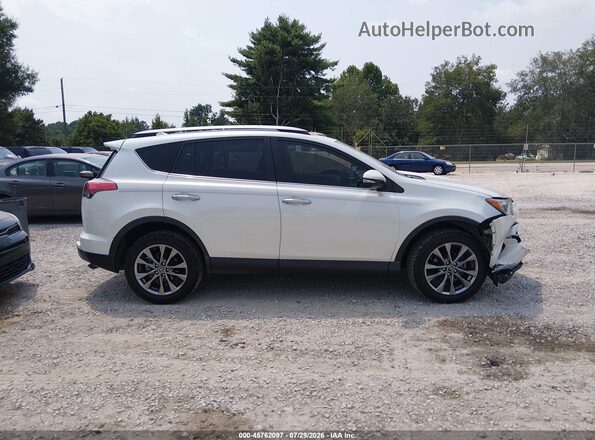 JTMYFREV2JJ167028 2018 TOYOTA RAV4 White Вид задньої частини салону