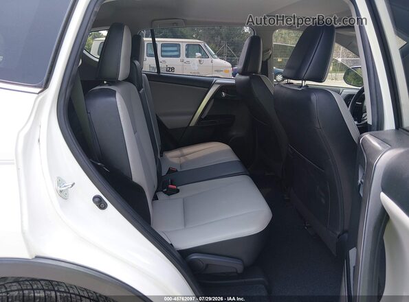 JTMYFREV2JJ167028 2018 TOYOTA RAV4 White Вид наклейки з VIN-кодом