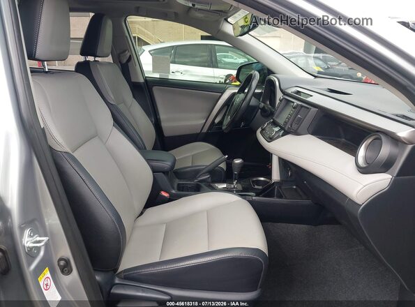 JTMYFREV2JJ180782 2018 TOYOTA RAV4 Silver Front interior view