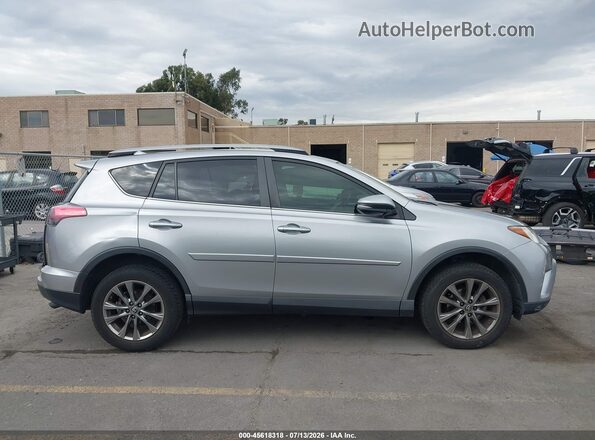 JTMYFREV2JJ180782 2018 TOYOTA RAV4 Silver Rear interior view