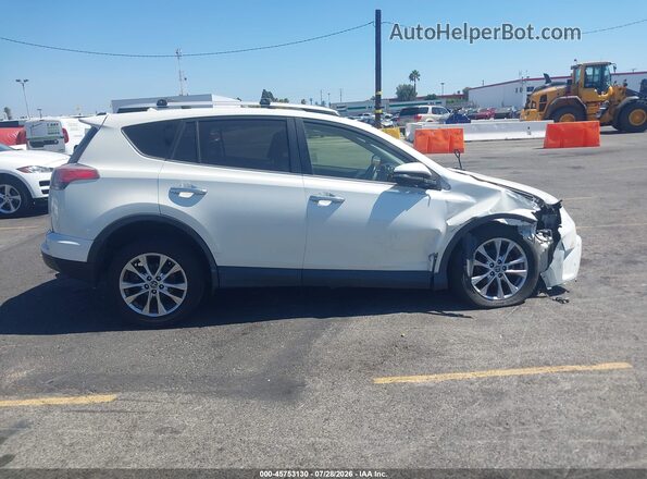 JTMYFREV3GJ099511 2016 TOYOTA RAV4 Белый Вид задней части салона