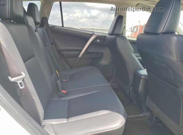 JTMYFREV8JJ734665 2018 TOYOTA RAV4 White Rear interior view