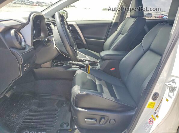 JTMYFREV8JJ734665 2018 TOYOTA RAV4 White Front interior view
