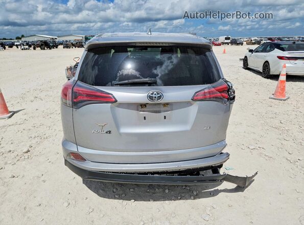 JTMZFREV0JJ198217 2018 TOYOTA RAV4 Silver Հետևի տեսք