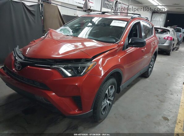 JTMZFREV1GJ089869 2016 TOYOTA RAV4 Orange Front left