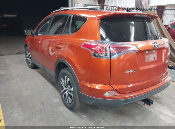 JTMZFREV1GJ089869 2016 TOYOTA RAV4 Orange Rear left